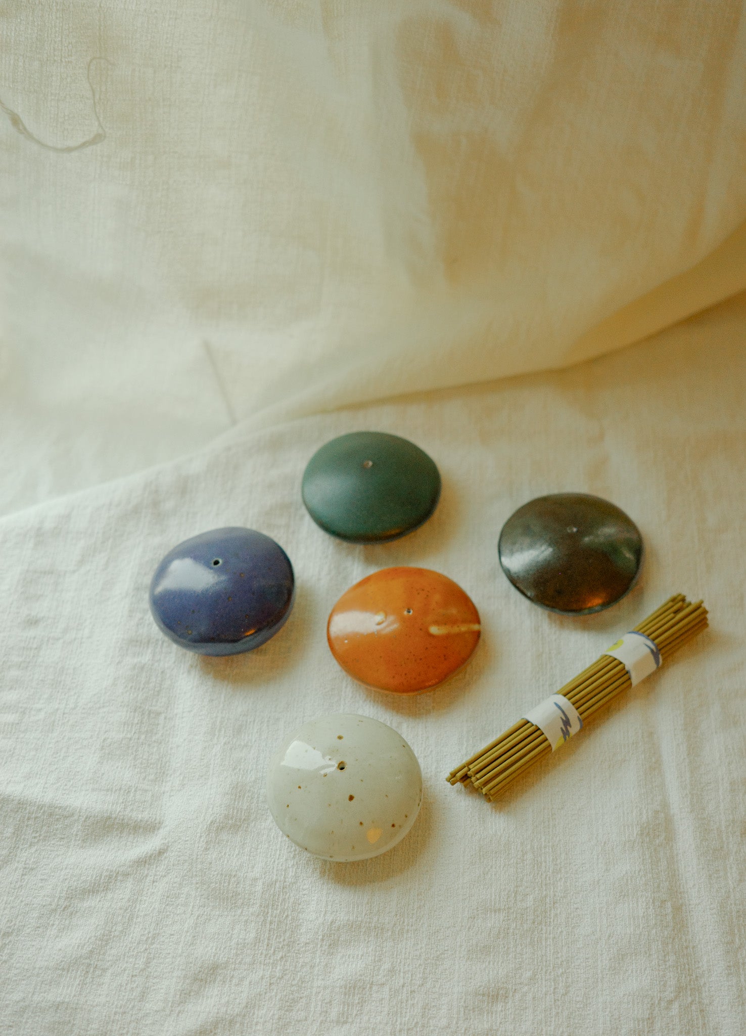 Small pebble incense holders